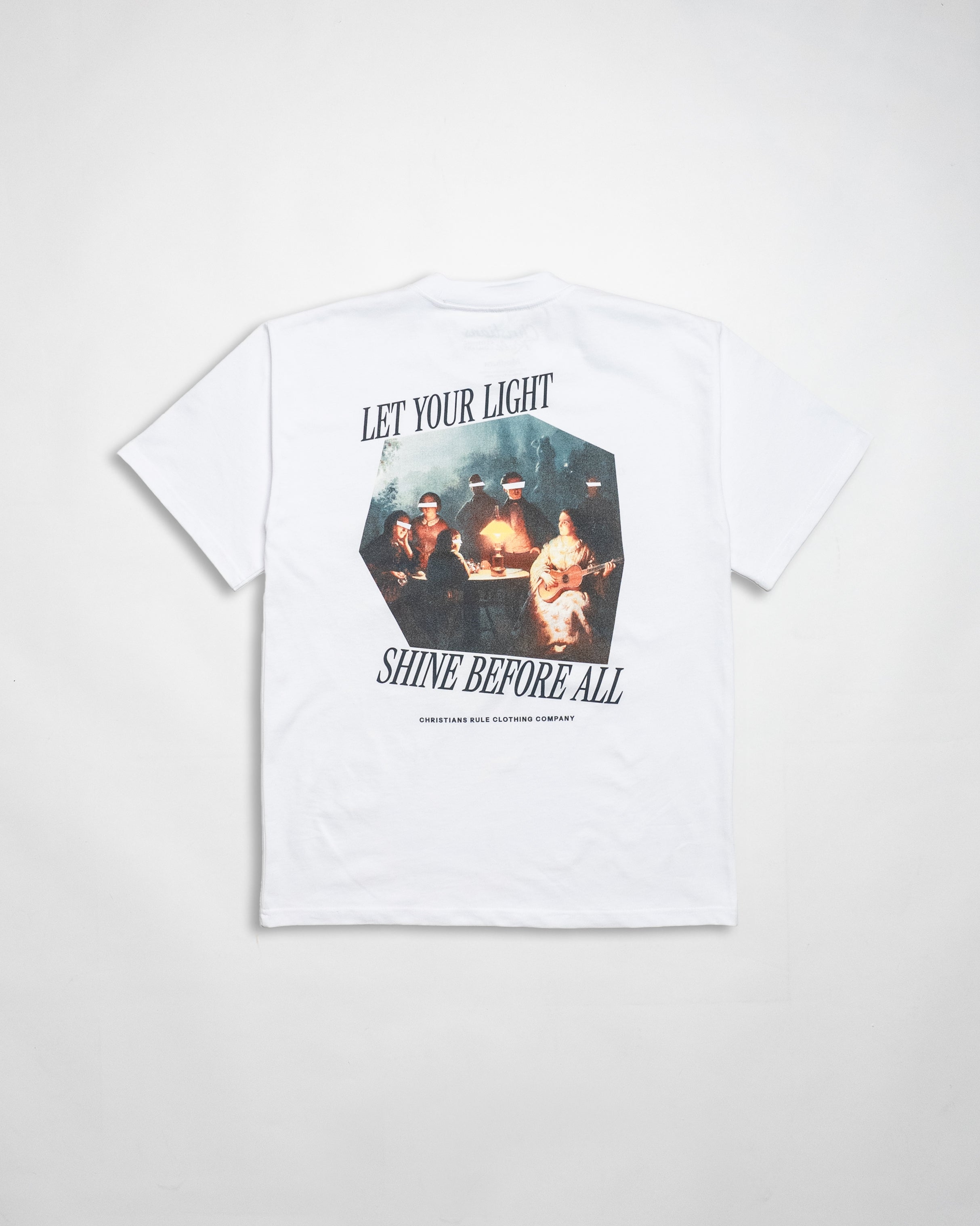 White heavyweight Christian t-shirt with art design and black text that says 'Let your light shine before all', against a white background.