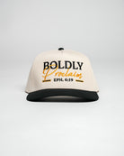 Cream and black Christian cap with 'Boldly Proclaim' embroidered text, against a white background.